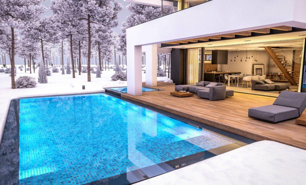 Ein Pool und Haus im Winter mit Schnee